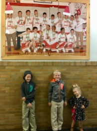 Posing under a poster of dad's high school basketball team as ACSI state champs!